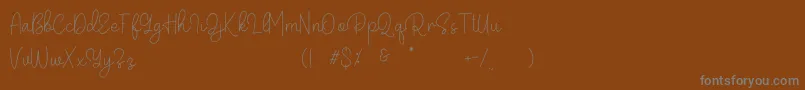 Belandia Font – Gray Fonts on Brown Background