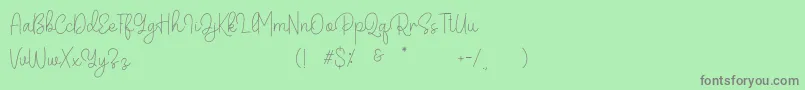 Belandia-Schriftart – Graue Schriften auf grünem Hintergrund