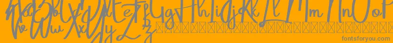 Belatoni-Schriftart – Graue Schriften auf orangefarbenem Hintergrund