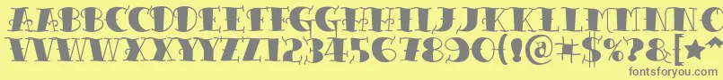 Czcionka Tattooletteringblack – szare czcionki na żółtym tle