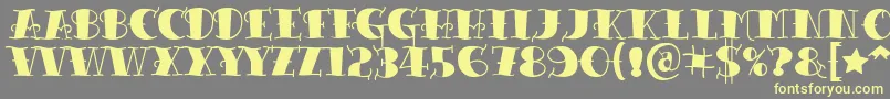 Tattooletteringblack Font – Yellow Fonts on Gray Background