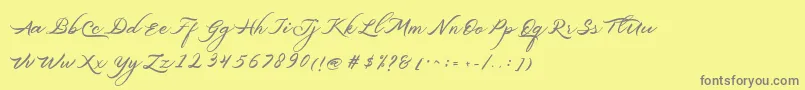 Belgiansignature-Schriftart – Graue Schriften auf gelbem Hintergrund