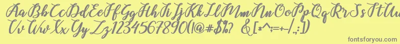 Belinda Script Font – Gray Fonts on Yellow Background