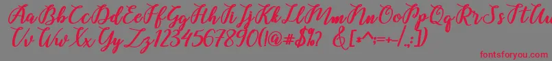 フォントBelinda Script – 赤い文字の灰色の背景