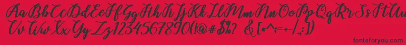 Fonte Belinda Script – fontes pretas em um fundo vermelho