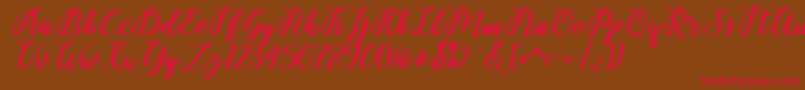 Belinda Script Font – Red Fonts on Brown Background