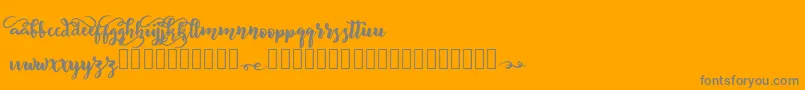 BeliveD-Schriftart – Graue Schriften auf orangefarbenem Hintergrund