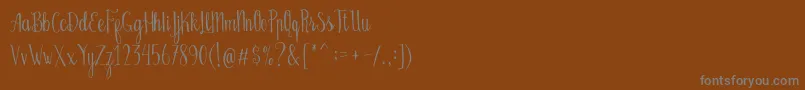 Czcionka Bellanie Script Free Demo – szare czcionki na brązowym tle