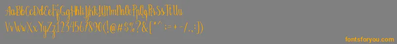 Bellanie Script Free Demo-fontti – oranssit fontit harmaalla taustalla