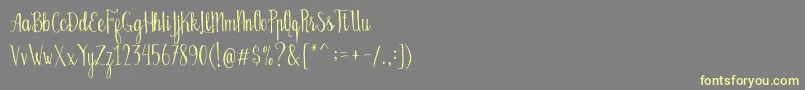 Fonte Bellanie Script Free Demo – fontes amarelas em um fundo cinza