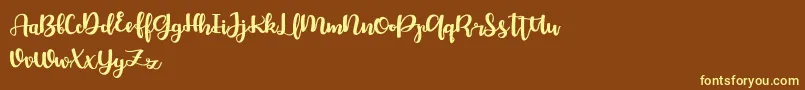 Bellco FREE Font – Yellow Fonts on Brown Background