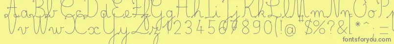 BelleAllureDuctus Fin-fontti – harmaat kirjasimet keltaisella taustalla