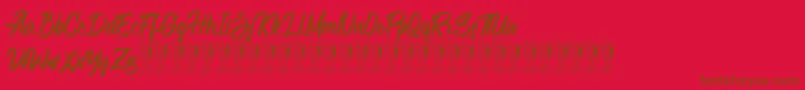 Шрифт Bellsmore Brush – коричневые шрифты на красном фоне