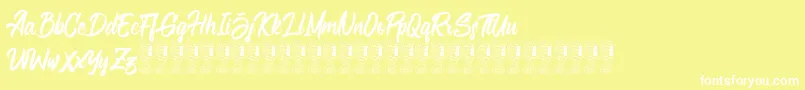 Bellsmore Brush Font – White Fonts on Yellow Background