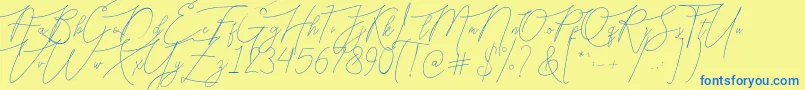フォントBellya Vaky – 青い文字が黄色の背景にあります。