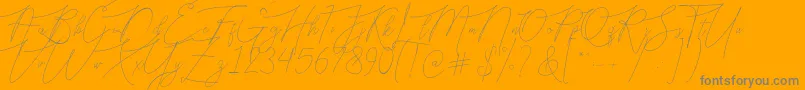 Bellya Vaky-Schriftart – Graue Schriften auf orangefarbenem Hintergrund