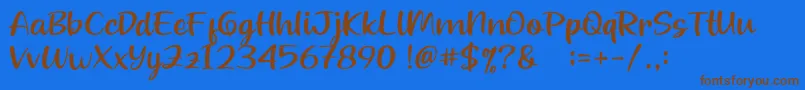 Beloved Teacher Font – Brown Fonts on Blue Background