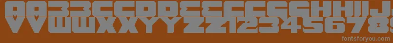 Шрифт Benny Benasi Font Remake – серые шрифты на коричневом фоне