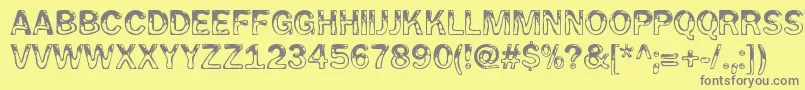 WetpetRegular-fontti – harmaat kirjasimet keltaisella taustalla