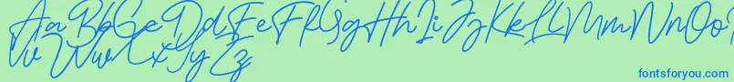 Bessita Handwriting Free-Schriftart – Blaue Schriften auf grünem Hintergrund