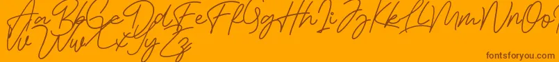 Bessita Handwriting Free-Schriftart – Braune Schriften auf orangefarbenem Hintergrund