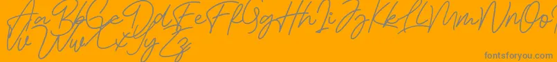 Bessita Handwriting Free-Schriftart – Graue Schriften auf orangefarbenem Hintergrund