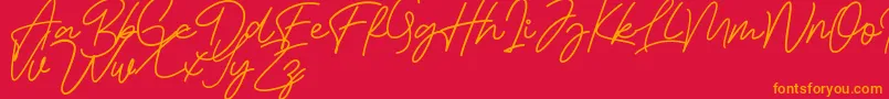 Bessita Handwriting Free Font – Orange Fonts on Red Background