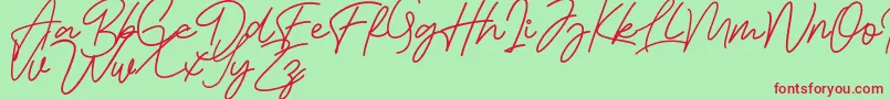 Bessita Handwriting Free Font – Red Fonts on Green Background