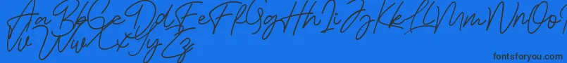 Bessita Handwriting Free-Schriftart – Schwarze Schriften auf blauem Hintergrund