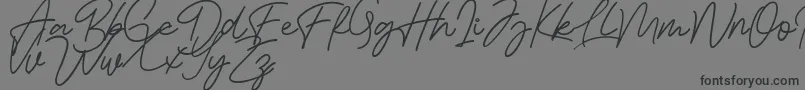 Bessita Handwriting Free Font – Black Fonts on Gray Background