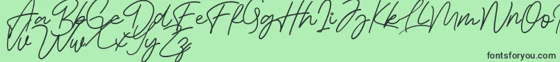 フォントBessita Handwriting Free – 緑の背景に黒い文字