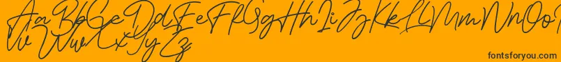 Bessita Handwriting Free Font – Black Fonts on Orange Background