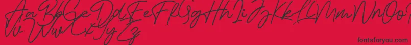 Bessita Handwriting Free Font – Black Fonts on Red Background