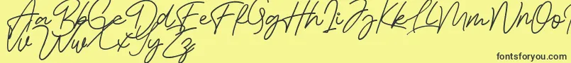 Fonte Bessita Handwriting Free – fontes pretas em um fundo amarelo