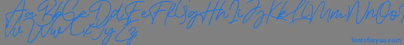Bessita Handwriting Free Font – Blue Fonts on Gray Background