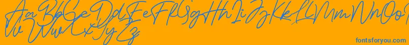 Шрифт Bessita Handwriting Free – синие шрифты на оранжевом фоне