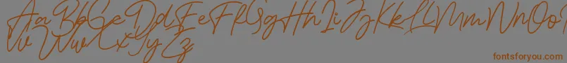 Шрифт Bessita Handwriting Free – коричневые шрифты на сером фоне