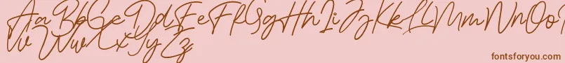 Bessita Handwriting Free Font – Brown Fonts on Pink Background