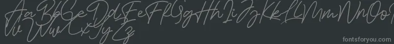 Bessita Handwriting Free-fontti – harmaat kirjasimet mustalla taustalla