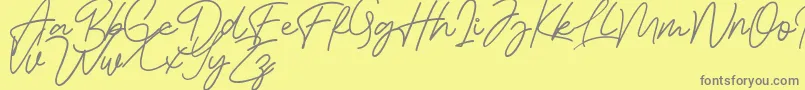 Bessita Handwriting Free Font – Gray Fonts on Yellow Background