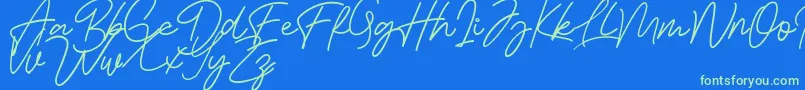 Bessita Handwriting Free Font – Green Fonts on Blue Background