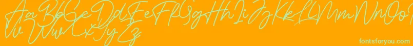 Bessita Handwriting Free Font – Green Fonts on Orange Background