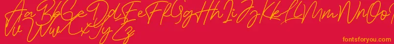 Bessita Handwriting Free Font – Orange Fonts on Red Background