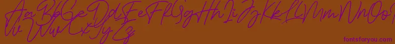 Bessita Handwriting Free Font – Purple Fonts on Brown Background