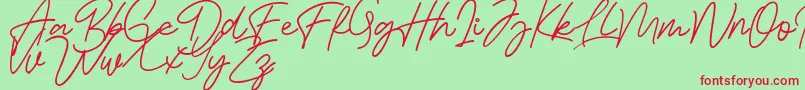 Bessita Handwriting Free Font – Red Fonts on Green Background