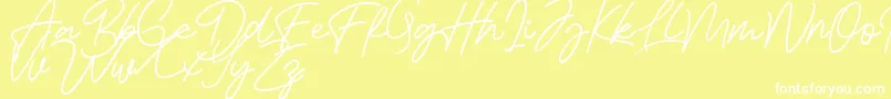 Czcionka Bessita Handwriting Free – białe czcionki na żółtym tle