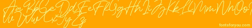 Bessita Handwriting Free-Schriftart – Gelbe Schriften auf orangefarbenem Hintergrund
