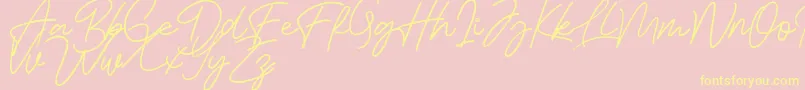 Fonte Bessita Handwriting Free – fontes amarelas em um fundo rosa