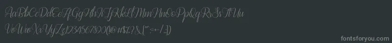 Bestilla Script DEMO-fontti – harmaat kirjasimet mustalla taustalla