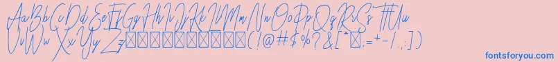 フォントBesttones Regular DEMO – ピンクの背景に青い文字